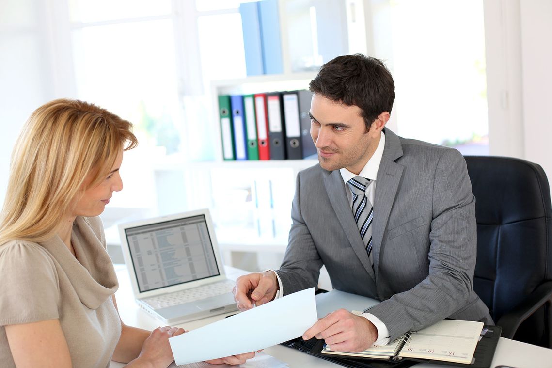 a woman having a meeting with a divorce lawyer