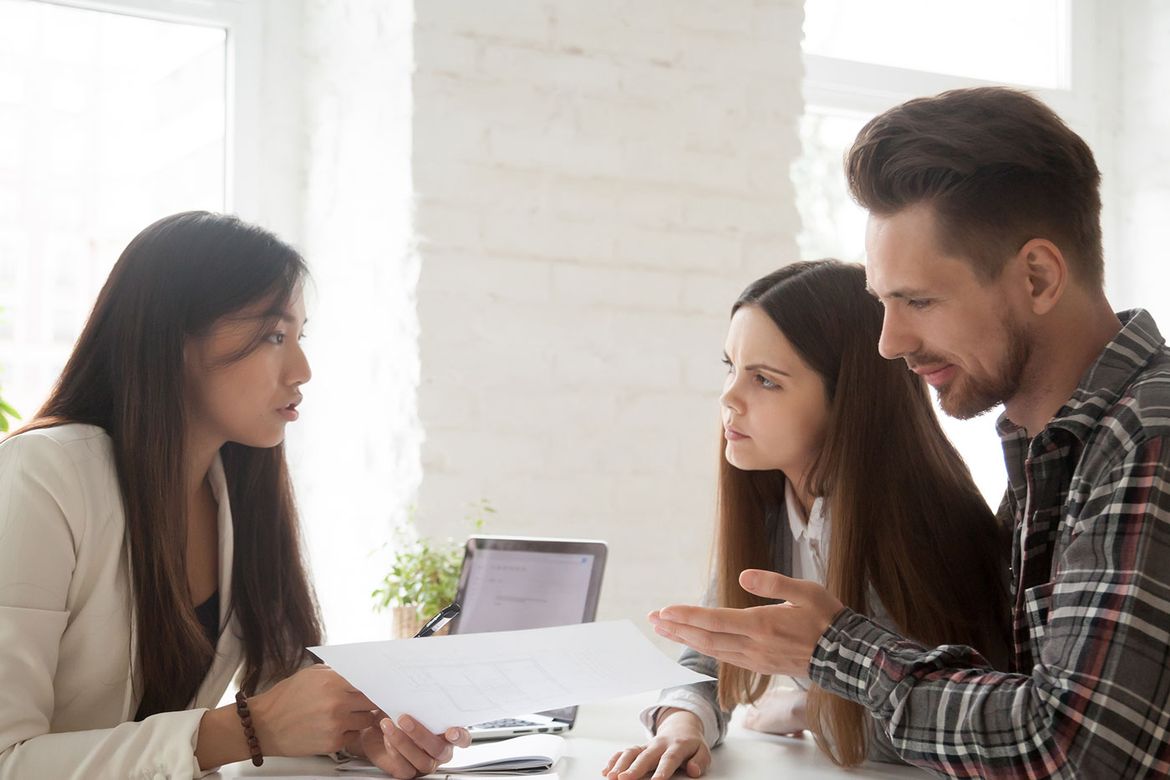 a parent and child during a meeting with a lawyer