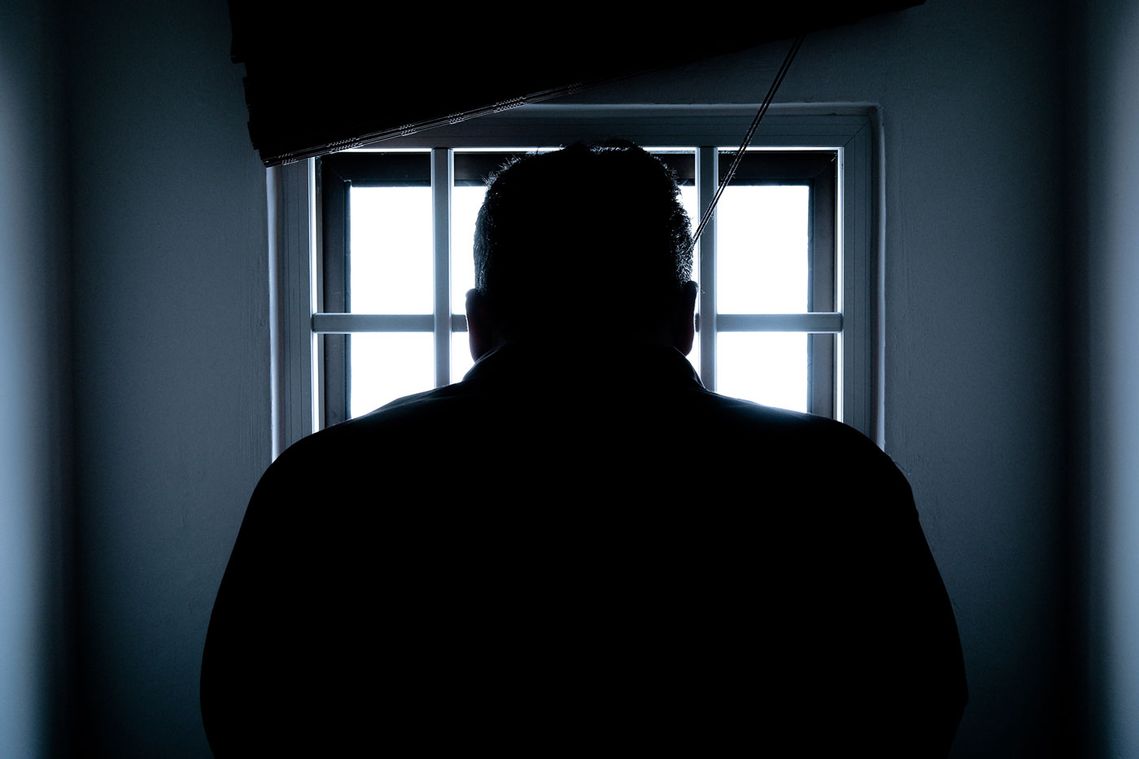 A criminal inside a prison cell